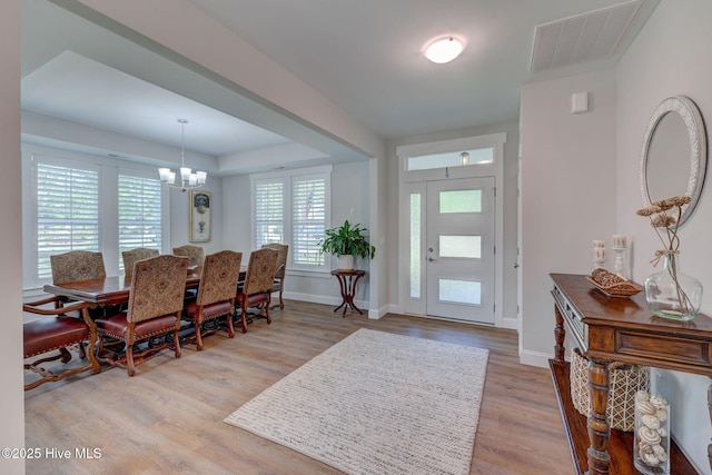 237 Pine Village Dr, Rocky Point, NC 28457 - foyer with a chandelier and wood finished floors
