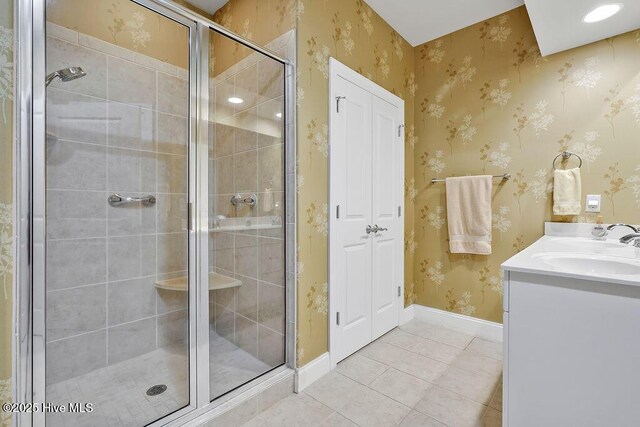 3284 Gardenwood Dr, Leland, NC 28451 - full bath with a shower stall, tile patterned flooring, baseboards, and double vanity