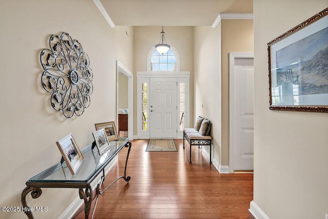 3284 Gardenwood Dr, Leland, NC 28451 - foyer entrance with hardwood / wood-style floors, crown molding, and baseboards