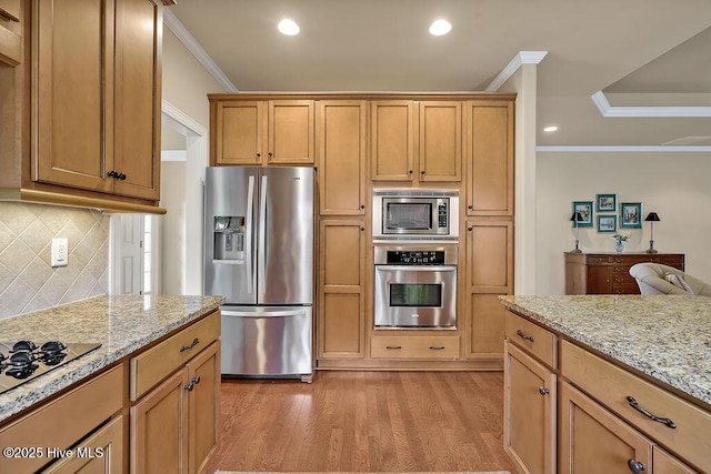 3284 Gardenwood Dr, Leland, NC 28451 - kitchen featuring appliances with stainless steel finishes, crown molding, light wood-type flooring, decorative backsplash, and light stone countertops
