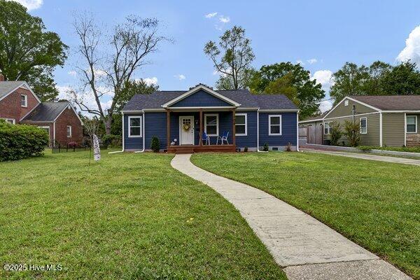 bungalow-style home featuring a porch and a front lawn