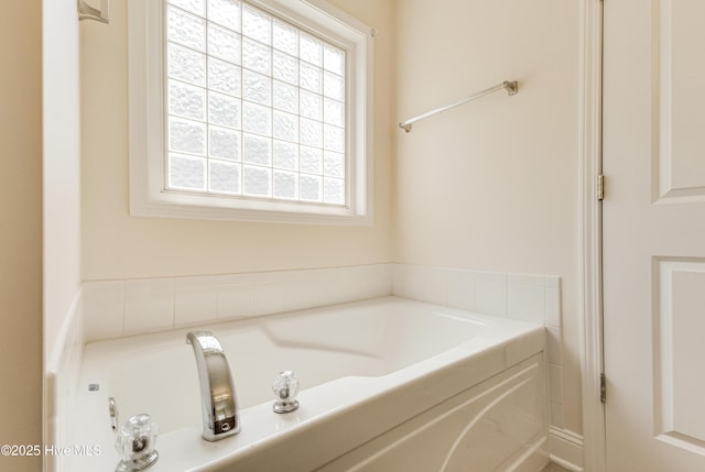 full bath with a bath and a wealth of natural light