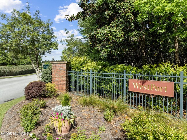 community sign with fence