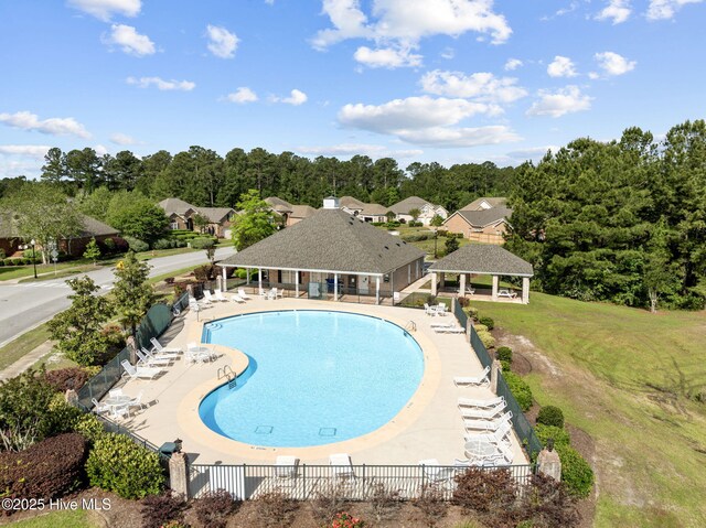 community pool featuring a gazebo and a patio