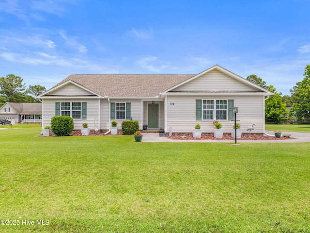 102 Flat Rock Ln, Richlands, NC 28574 - single story home featuring a front lawn and roof with shingles