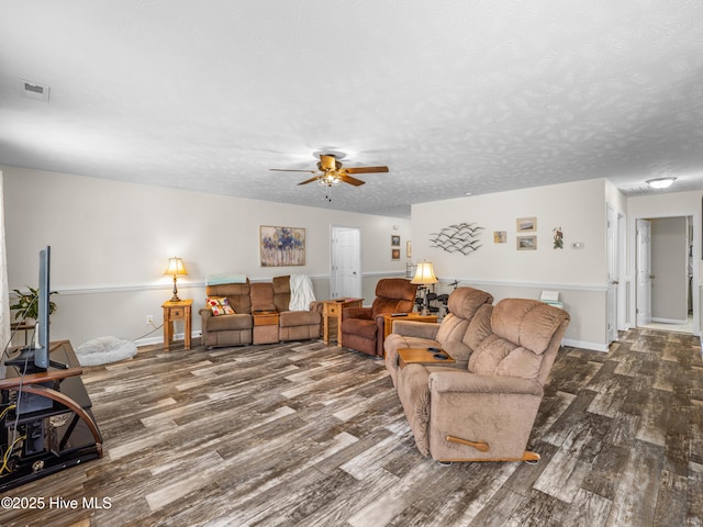 102 Flat Rock Ln, Richlands, NC 28574 - living area with dark wood-type flooring, ceiling fan, and baseboards