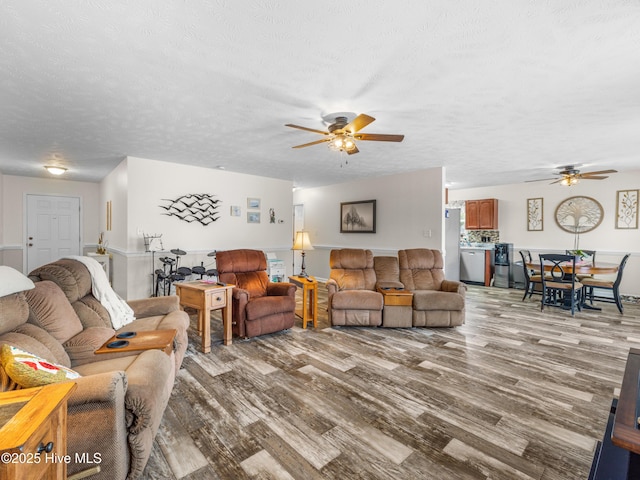 102 Flat Rock Ln, Richlands, NC 28574 - living area featuring a ceiling fan, wood finished floors, and a textured ceiling