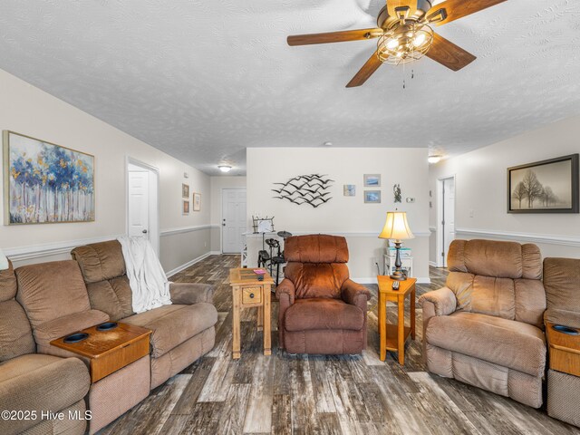 102 Flat Rock Ln, Richlands, NC 28574 - living area featuring a ceiling fan, wood finished floors, a textured ceiling, and baseboards