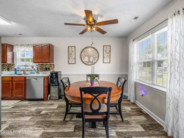 102 Flat Rock Ln, Richlands, NC 28574 - dining room with ceiling fan, dark wood finished floors, and baseboards