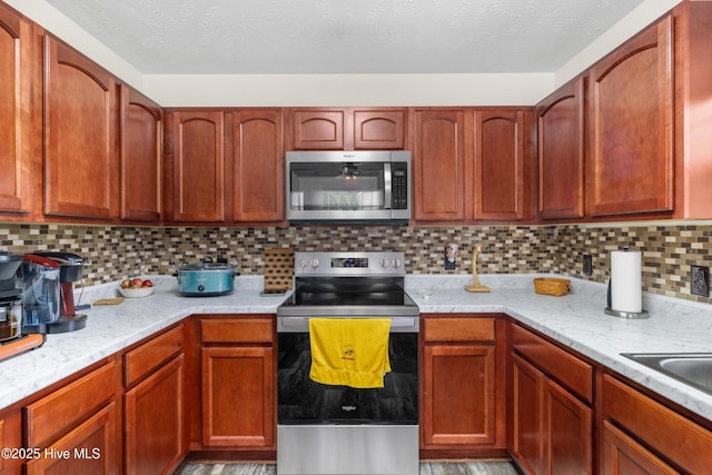 102 Flat Rock Ln, Richlands, NC 28574 - kitchen with stainless steel appliances and tasteful backsplash