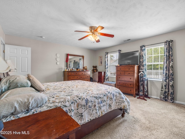 102 Flat Rock Ln, Richlands, NC 28574 - bedroom with light carpet, baseboards, ceiling fan, and a textured ceiling