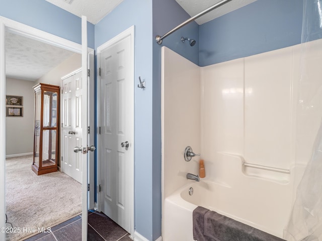 102 Flat Rock Ln, Richlands, NC 28574 - full bath featuring a textured ceiling, shower / bath combination, baseboards, and tile patterned floors