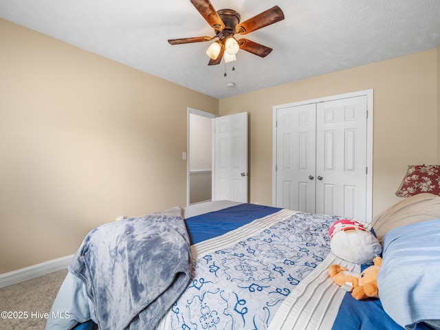 102 Flat Rock Ln, Richlands, NC 28574 - bedroom with carpet flooring, baseboards, a closet, and ceiling fan