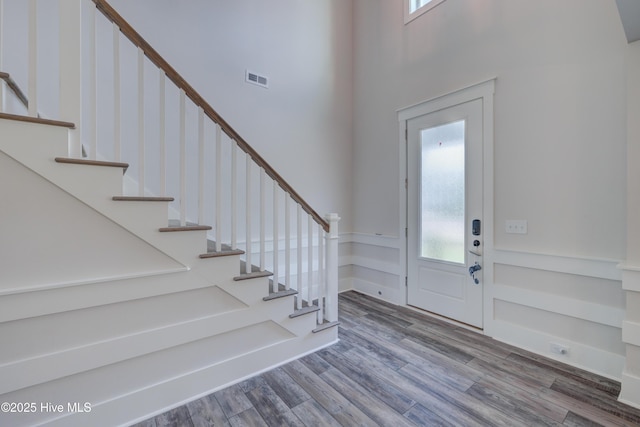 374 Yucca Ln, Wilmington, NC 28412 - entryway featuring wood finished floors, a high ceiling, and stairs