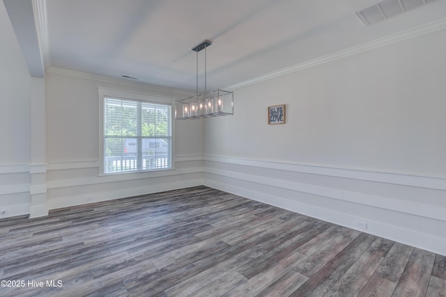 374 Yucca Ln, Wilmington, NC 28412 - empty room with wood finished floors, ornamental molding, and a chandelier