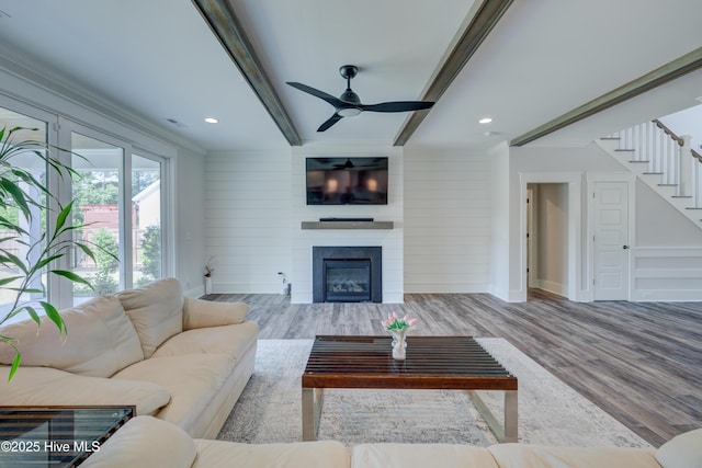 374 Yucca Ln, Wilmington, NC 28412 - living area with wood finished floors, beamed ceiling, a ceiling fan, ornamental molding, and stairs