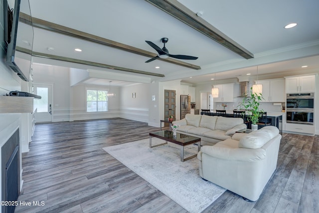 374 Yucca Ln, Wilmington, NC 28412 - living area with beamed ceiling, a ceiling fan, wood finished floors, recessed lighting, and crown molding