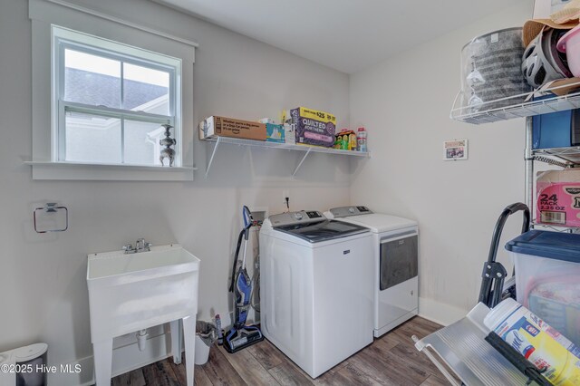 374 Yucca Ln, Wilmington, NC 28412 - laundry room featuring separate washer and dryer and wood finished floors