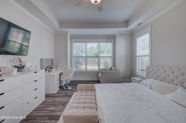 374 Yucca Ln, Wilmington, NC 28412 - bedroom with dark wood-style floors, a tray ceiling, a ceiling fan, and a desk