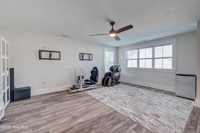 374 Yucca Ln, Wilmington, NC 28412 - exercise room featuring a ceiling fan, wood finished floors, and baseboards