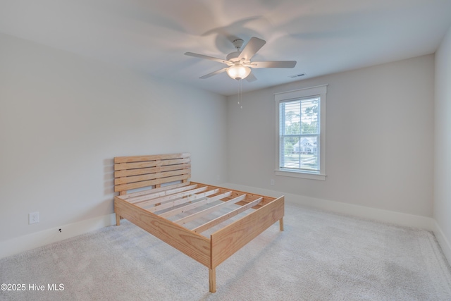 374 Yucca Ln, Wilmington, NC 28412 - bedroom featuring carpet flooring, baseboards, and a ceiling fan