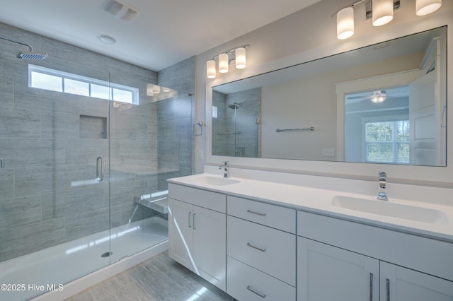 374 Yucca Ln, Wilmington, NC 28412 - full bathroom with plenty of natural light, double vanity, and a stall shower
