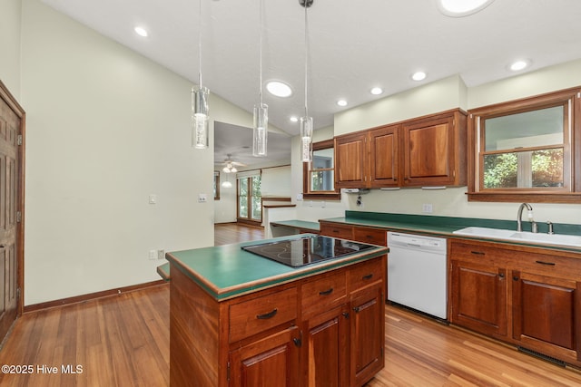 103 Arborvitae Ct, Pine Knoll Shores, NC 28512 - kitchen featuring dishwasher, black electric stovetop, light wood-style floors, a sink, and recessed lighting