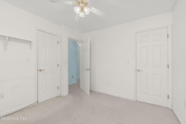 103 Arborvitae Ct, Pine Knoll Shores, NC 28512 - unfurnished bedroom featuring carpet, baseboards, and a ceiling fan