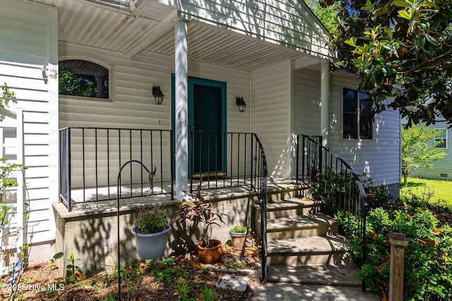 103 Arborvitae Ct, Pine Knoll Shores, NC 28512 - doorway to property featuring covered porch