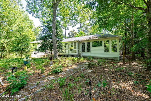 103 Arborvitae Ct, Pine Knoll Shores, NC 28512 - back of house featuring crawl space and a sunroom