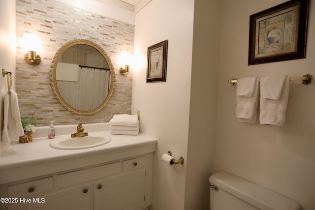 bathroom with toilet and vanity