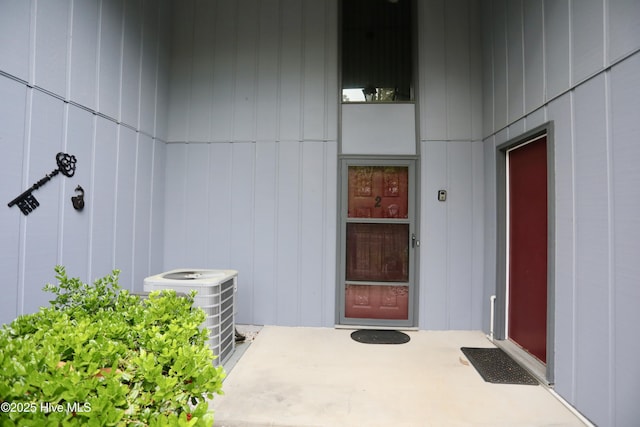 doorway to property featuring central AC unit
