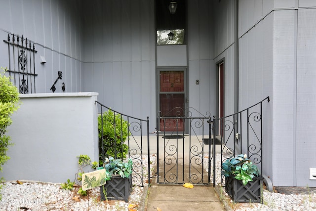 property entrance with fence and a gate