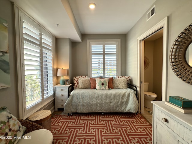 bedroom featuring visible vents