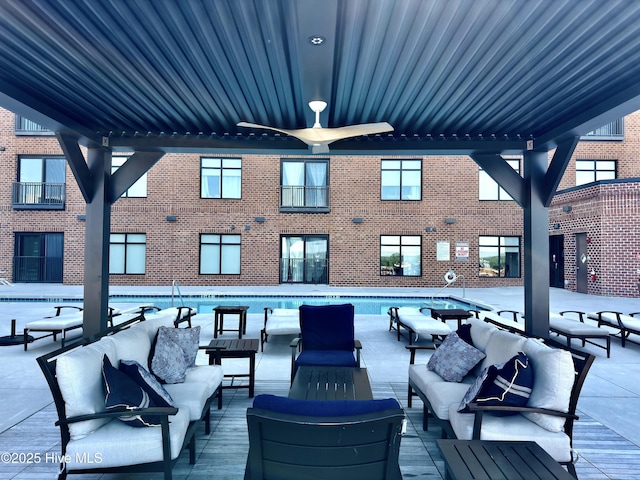 view of patio featuring outdoor lounge area and a community pool
