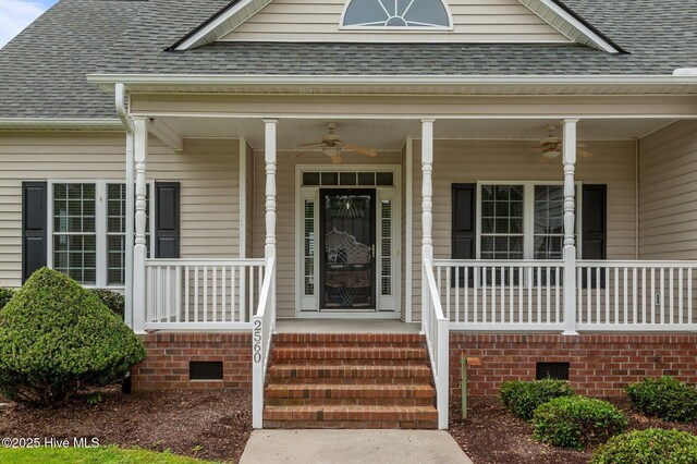 doorway to property featuring a porch, roof with shingles, ceiling fan, and crawl space