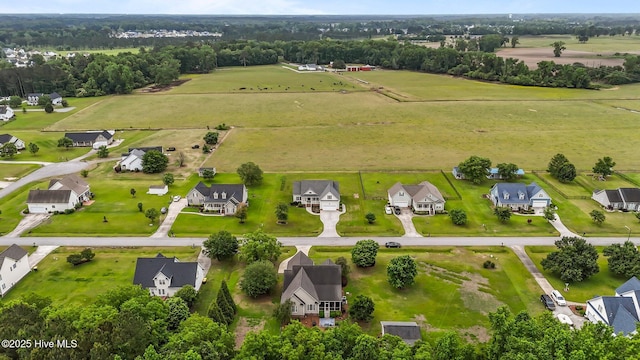 birds eye view of property featuring a rural view and a residential view