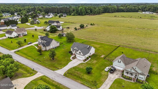 drone / aerial view with a rural view and a residential view