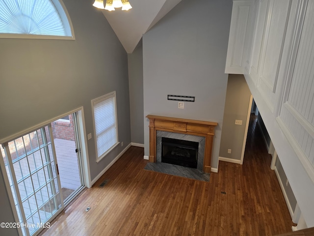 219 Drake Lndg, New Bern, NC 28560 - unfurnished living room with baseboards, a fireplace, visible vents, and wood finished floors