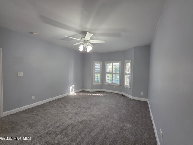 219 Drake Lndg, New Bern, NC 28560 - empty room with a ceiling fan, dark carpet, and baseboards