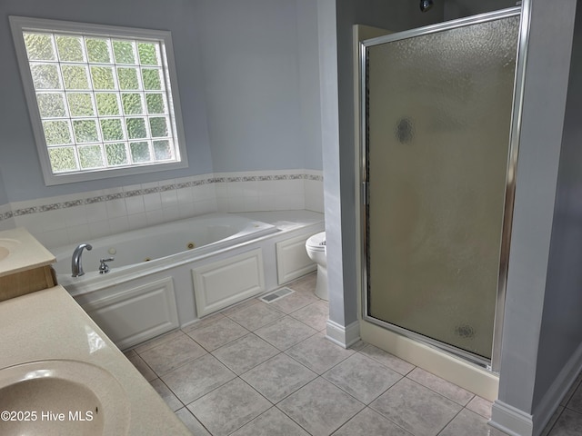 219 Drake Lndg, New Bern, NC 28560 - bathroom with toilet, vanity, a stall shower, tile patterned flooring, and a whirlpool tub