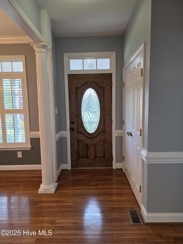 219 Drake Lndg, New Bern, NC 28560 - entrance foyer featuring baseboards, visible vents, wood finished floors, and decorative columns