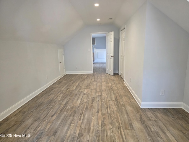 219 Drake Lndg, New Bern, NC 28560 - bonus room featuring vaulted ceiling, baseboards, dark wood-type flooring, and recessed lighting