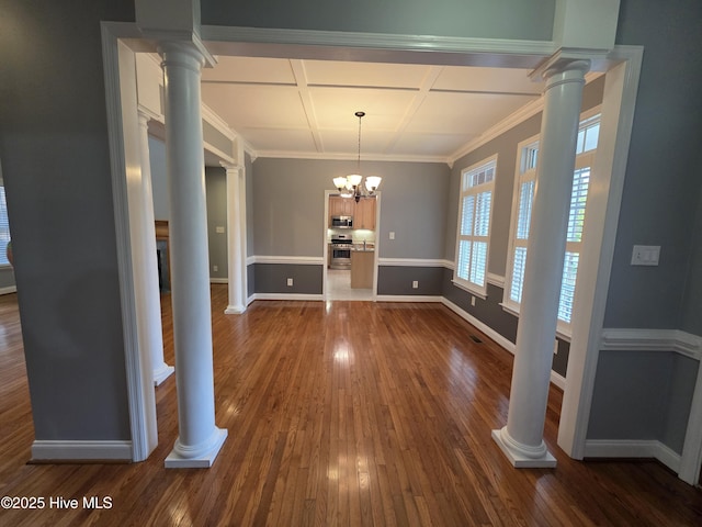 219 Drake Lndg, New Bern, NC 28560 - unfurnished dining area featuring a notable chandelier, coffered ceiling, baseboards, dark wood-style flooring, and ornate columns