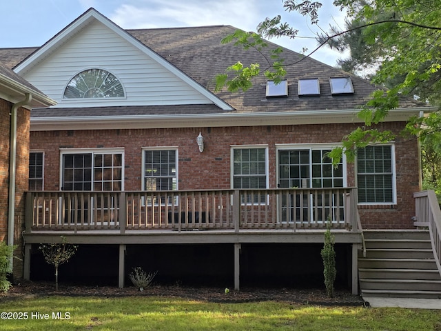 219 Drake Lndg, New Bern, NC 28560 - rear view of house featuring a deck, roof with shingles, and brick siding