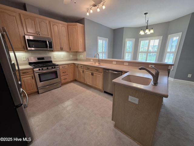 219 Drake Lndg, New Bern, NC 28560 - kitchen with a peninsula, stainless steel appliances, light brown cabinetry, and a sink