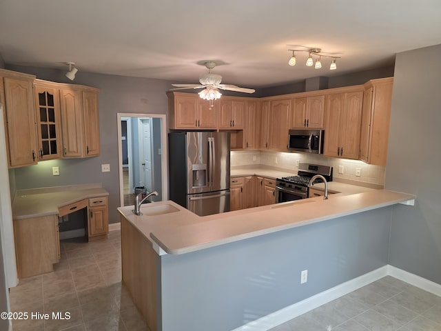 219 Drake Lndg, New Bern, NC 28560 - kitchen featuring a sink, stainless steel appliances, backsplash, light countertops, and a ceiling fan