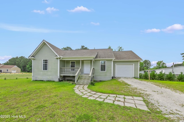 1406 Silverbrook Rd, Oriental, NC 28571 - ranch-style home featuring driveway, covered porch, a garage, and a front yard