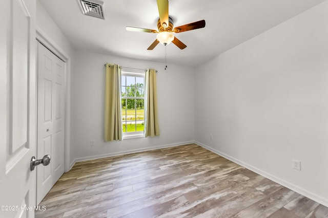 1406 Silverbrook Rd, Oriental, NC 28571 - unfurnished bedroom featuring a closet, wood finished floors, baseboards, and a ceiling fan