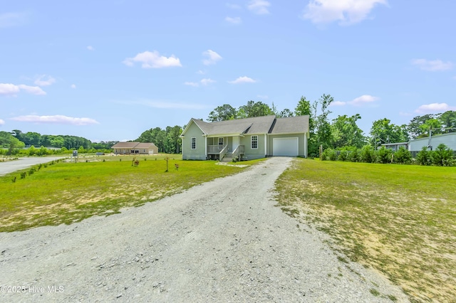1406 Silverbrook Rd, Oriental, NC 28571 - ranch-style home with an attached garage, dirt driveway, and a front lawn